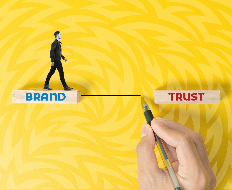 Brand trust is built in the details - person walking on brand block that's being connected to trust block